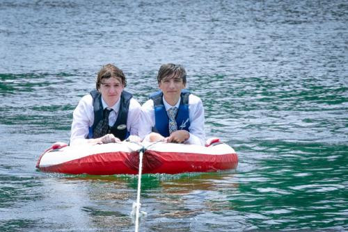 KristaNutterPhotography8505218 two senior boys in shirts and ties on an inner tube on a lake destination portrait sessions